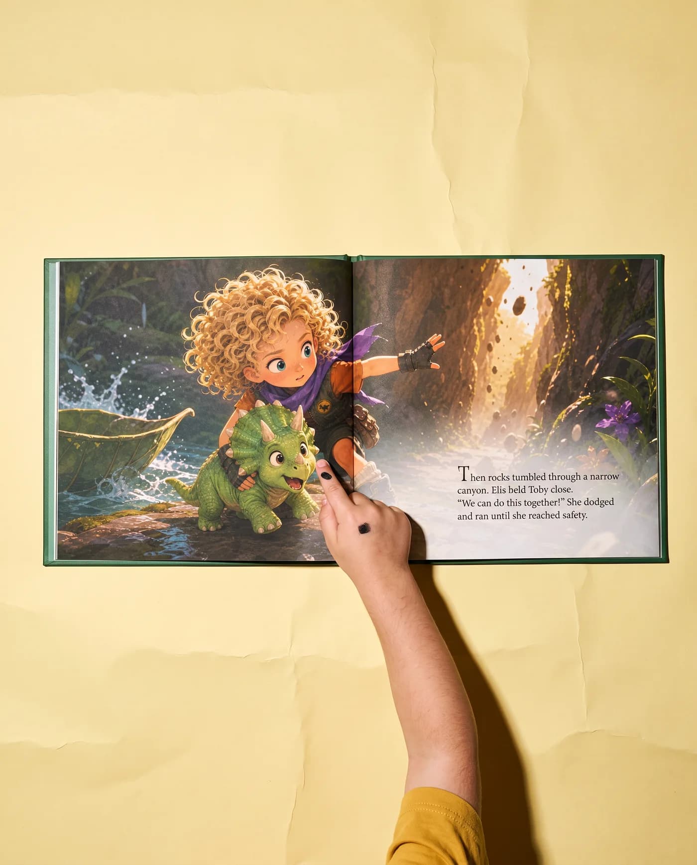 A child points at a real Lumi spread lying open on a sky-blue backdrop